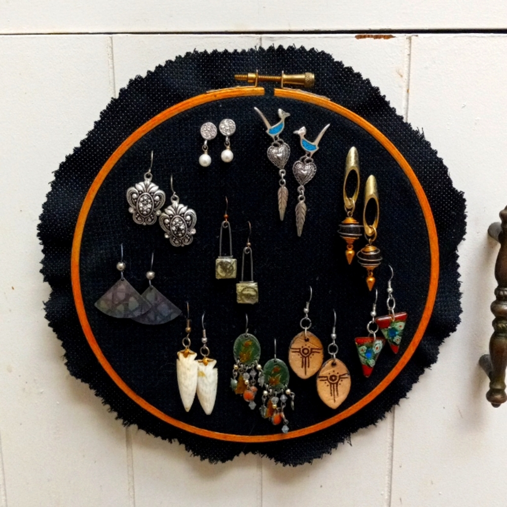 10 pairs of assorted costume earrings. Made from various materials.